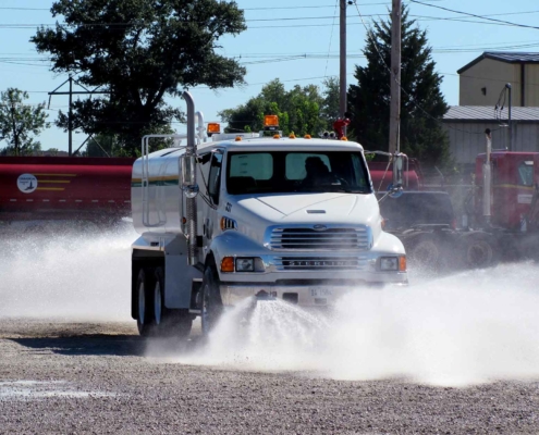 sterling-water-tank-truck-spraying-water-out-on-lot-as-demonstration