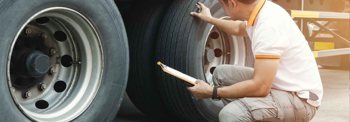 Man inspecting a truck