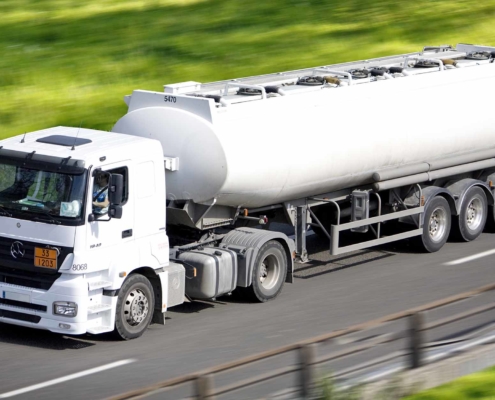 A semi truck driving on the road