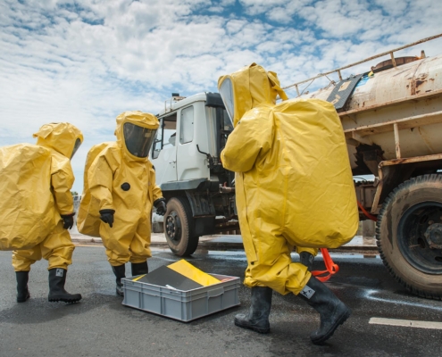 Image of people wearing hazmat suits testing a tanker truck