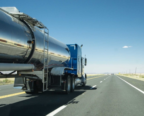 Tank truck driving down the open road