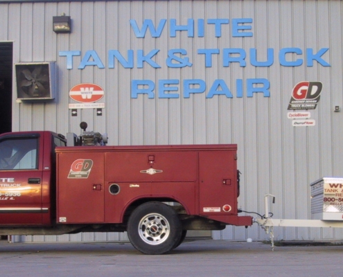 Truck parked in front of White Tank & Truck Repair
