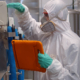 Hazmat inspector reading information at a plant