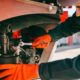 Mechanic wrenching a truck