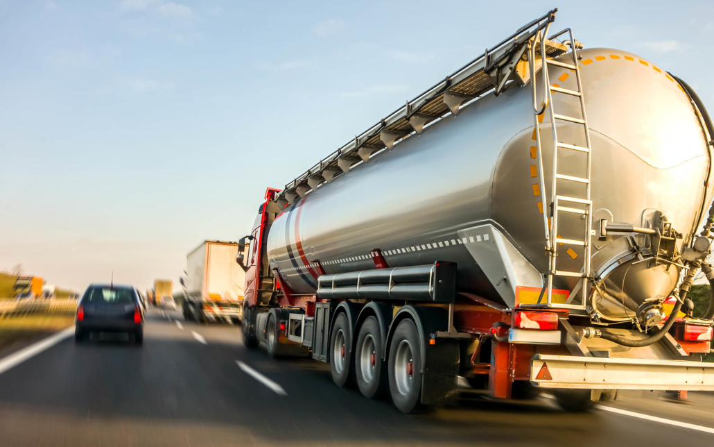 Tanker truck driving down the road