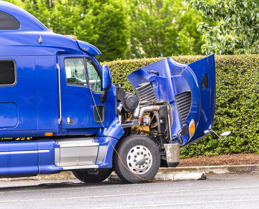 Side view of blue truck with hood open