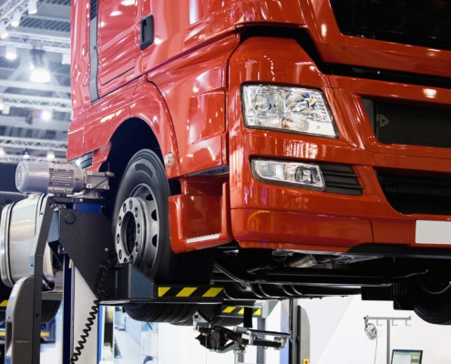 Commercial truck lifted in a repair facility