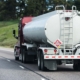 Large tanker truck hauling on highway