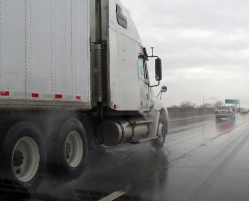 rainy highway with semi driving