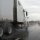 rainy highway with semi driving